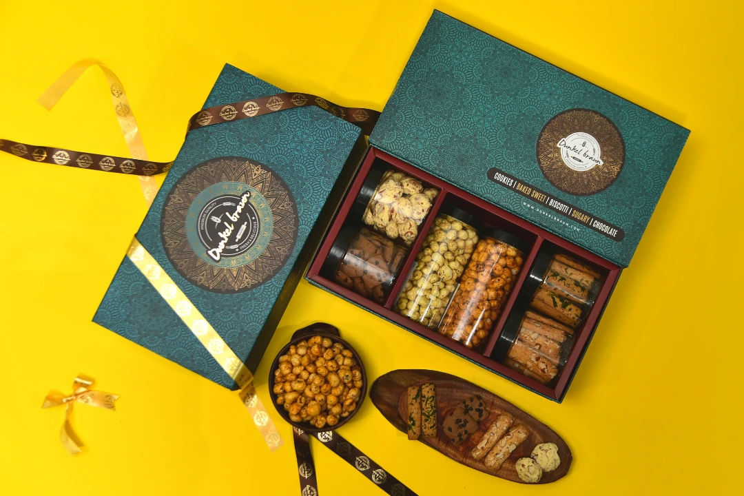 Open joy Gift box has cookies, Tal makhna and chips baked till perfection